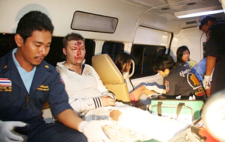 Rescue workers take Denis Fatykhov to hospital to be patched up enough to go to jail for reckless driving.